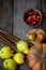 Autumn still life on a wooden table top view. Pumpkin, chestnuts, acorns, quince, nuts, cones. Rustic background. Quince and pear