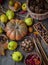 Autumn still life on a wooden table top view. Pumpkin, chestnuts, acorns, quince, nuts, cones. Rustic background. Quince and pear