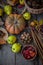 Autumn still life on a wooden table top view. Pumpkin, chestnuts, acorns, quince, nuts, cones. Rustic background. Quince and pear