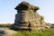 Autumn sunlight shines on the Mother Cap gritstone outcrop