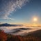 Autumn sunny sunrise over scenic valley. Scenic autumn morning on mountains hills with fog. Fall panoramic