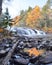 Autumn sunrise at Buttermilk Falls, Adirondack Mountains, with reflections