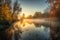 autumn sunrise, with mist rolling over the water and trees