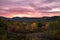 Autumn sunset over beautiful forested mountains