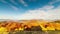 Autumn sunset valley. Close-up of the sunset of a dense golden aspen grove in a valley at the foot of the high peaks of