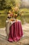 Autumn. A table set on the banks of the lake decorated with a bouquet of autumn leaves. Tea party. fruit teas with lemon