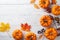 Autumn Thanksgiving background. Pumpkins and leaves on white table top view