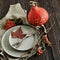 Autumn Thanksgiving dinner table setting with pumpkins, fallen leaves and vintage cutlery top view
