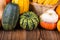 Autumn Thanksgiving motive with different colorful pumpkins on a rustic wooden background