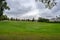 Autumn town landscape view of the large grassy pit Gropen on a green field in Leksand Sweden