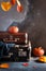 Autumn travel concept. Vintage old fashioned Suitcases with pumpkins and autumn leaves on dark background. Copy space