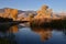 Autumn tree reflection in water of marsh in mountain valley wetlands