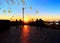 Autumn  tree yellow  leaves fall ,people on city observation balcony in park relaxing   and watch  evening sunset in Tallinn Eston