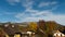 Autumn valley with the  beautiful village on a green hills at the Austrian alps