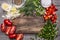 Autumn vegetables and herbs on a cutting board with spices and salt on wooden background close up top view space for text