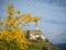 Autumn view of the Church of the idyllic village of Cortaccia. Cortaccia extends on the sunny side of the wine road. South Tyrol,