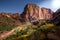 Autumn view of Kolob Canyon, part of Zion National Park in Utah, and red road meandering up to the lookout point.