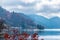 autumn view of lake Chuzenji with houses, trees and mountains near Nikko, Japan, travel background