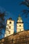 Autumn view of main square of Kremnica town and Kremnica castle Town Castle in Kremnica with church tower in background.