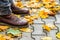 Autumn walk on the pavement. Brown boots