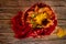 Autumn warm composition in red tones on a wooden background with a cup of tea, garland