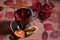 Autumn warming drink mulled wine in a glass Cup on a dark background with autumn leaves and viburnum berries.