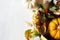 Autumn wildflowes boho composition with wreath of dry plants, grass, berry and pumpkins