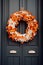 Autumn wreath on a dark door