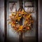 Autumn Wreath Hanging on an Old Distressed Door