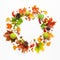 Autumn wreath made of leaves, berries on white background.