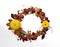 Autumn wreath of yellow leaves of apples pumpkins and chestnuts white background
