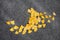 Autumn yellow leaves fly around on a gray graphite background