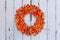 Autumnal Decoration Wreath with Physalis and Withywind on grunge background