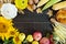 Autumnal food background. Crop of vegetables and fruit on wooden background