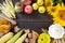 Autumnal food background. Crop of vegetables and fruit on wooden background.