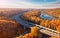 Autumnal Highway Views Aerial Serenity over Woods and Overpasses