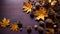 Autumnal image with pine cones, yellowing leaves, and a purple background