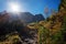 Autumnal landscape karwendel mountains with bright sun and hiking path