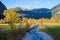 Autumnal landscape karwendel valley with little creek and golden maple trees, Ahornboden austria