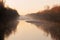 Autumnal morning mist river idyll by sunrise, brownish-orange shades