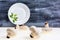 Autumnal Mushrooms with white background and gray wooden table and empty dish