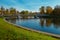 Autumnal park. Lake with reflection. Morning. Bridge