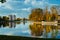 Autumnal park. Lake with reflection. Morning. Bridge