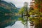 Autumnal scenic view of boats on the Bohinj lake