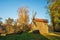 Autumnal Serenity: Wooden Windmill in Rural Landscape