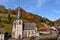 Autumnal shot of the typical church fall as the bright trees turn orange and red