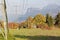 Autumnal view of Rhine valley with Karren mountain in background and flocks of storks