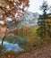 Autumnal walkway along lake Laudachsee, katzenstein mountain, austrian alps