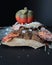 Autumnally decorated pumpkin with autumn foliage,snow and ice crystals