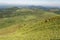 Auvergne France. View from Puy de Dome over green plain leading